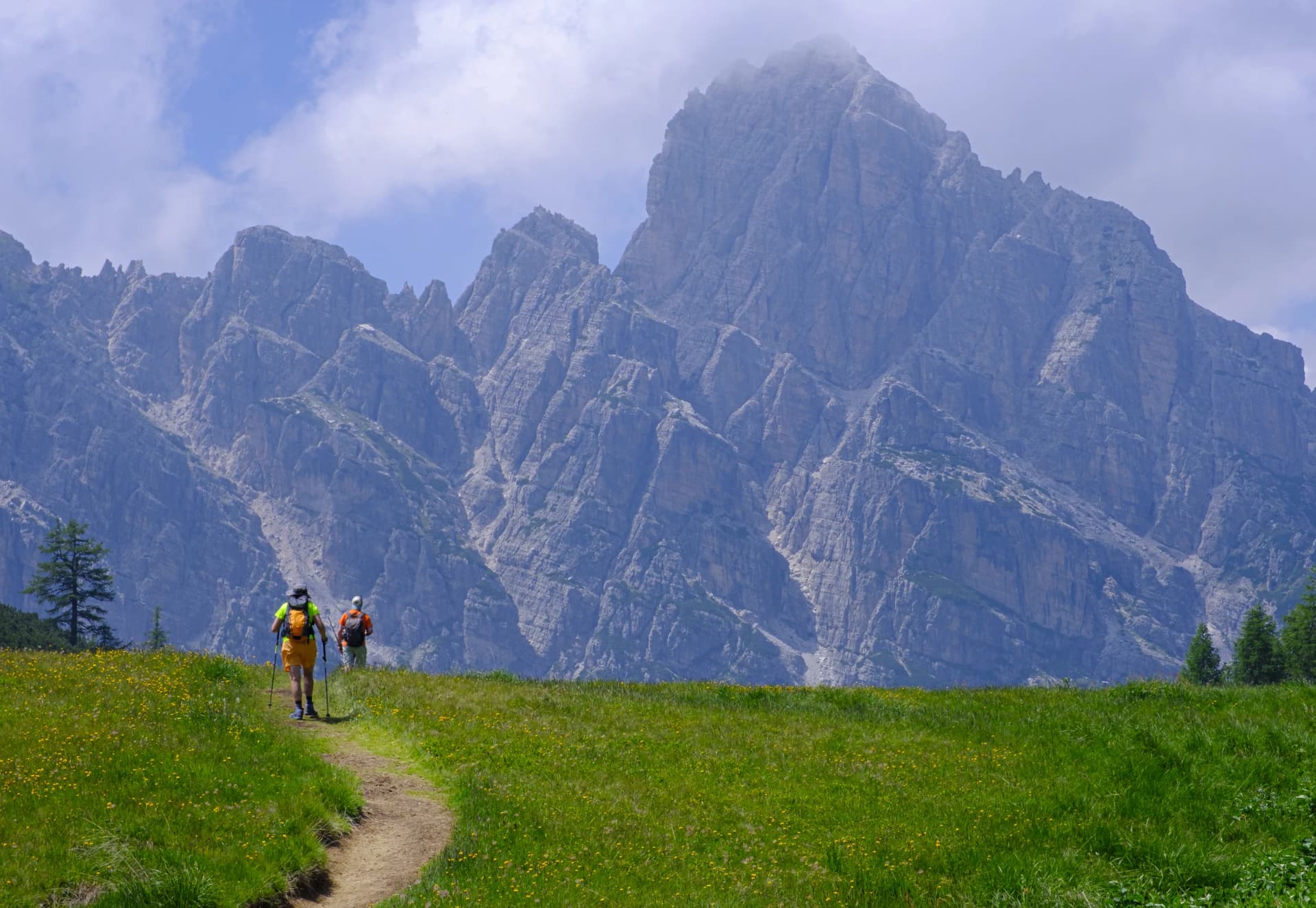 Hikers walking in the Zoldo Valley, Dolomites, Italy