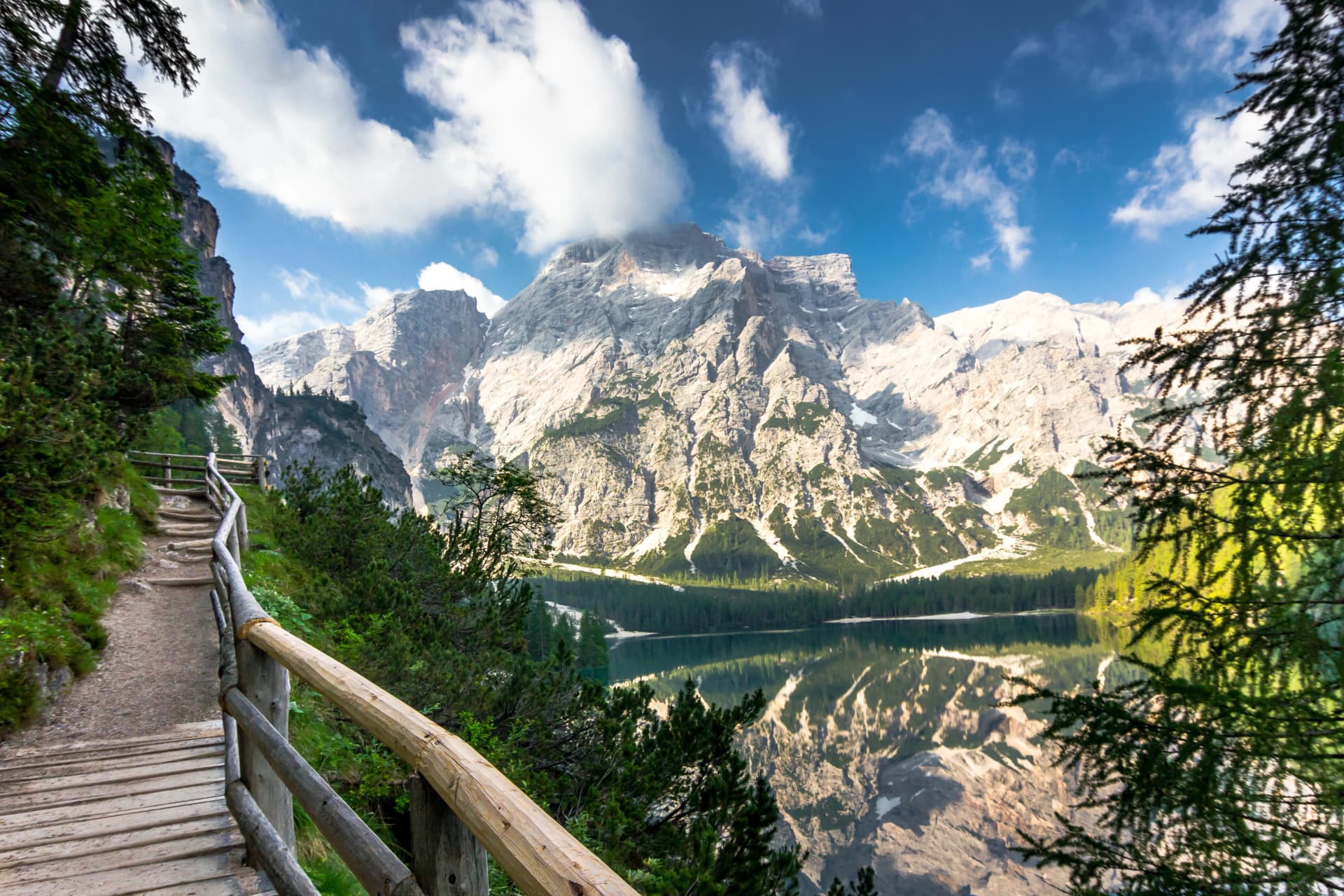 Lake Braies known as Lago di Braies, a trekking route around. Surrounded by the mountains reflected in the water.1st point of the trekking route Alta Via 1, The Dolomites, Alps, South Tyrol, Italy.