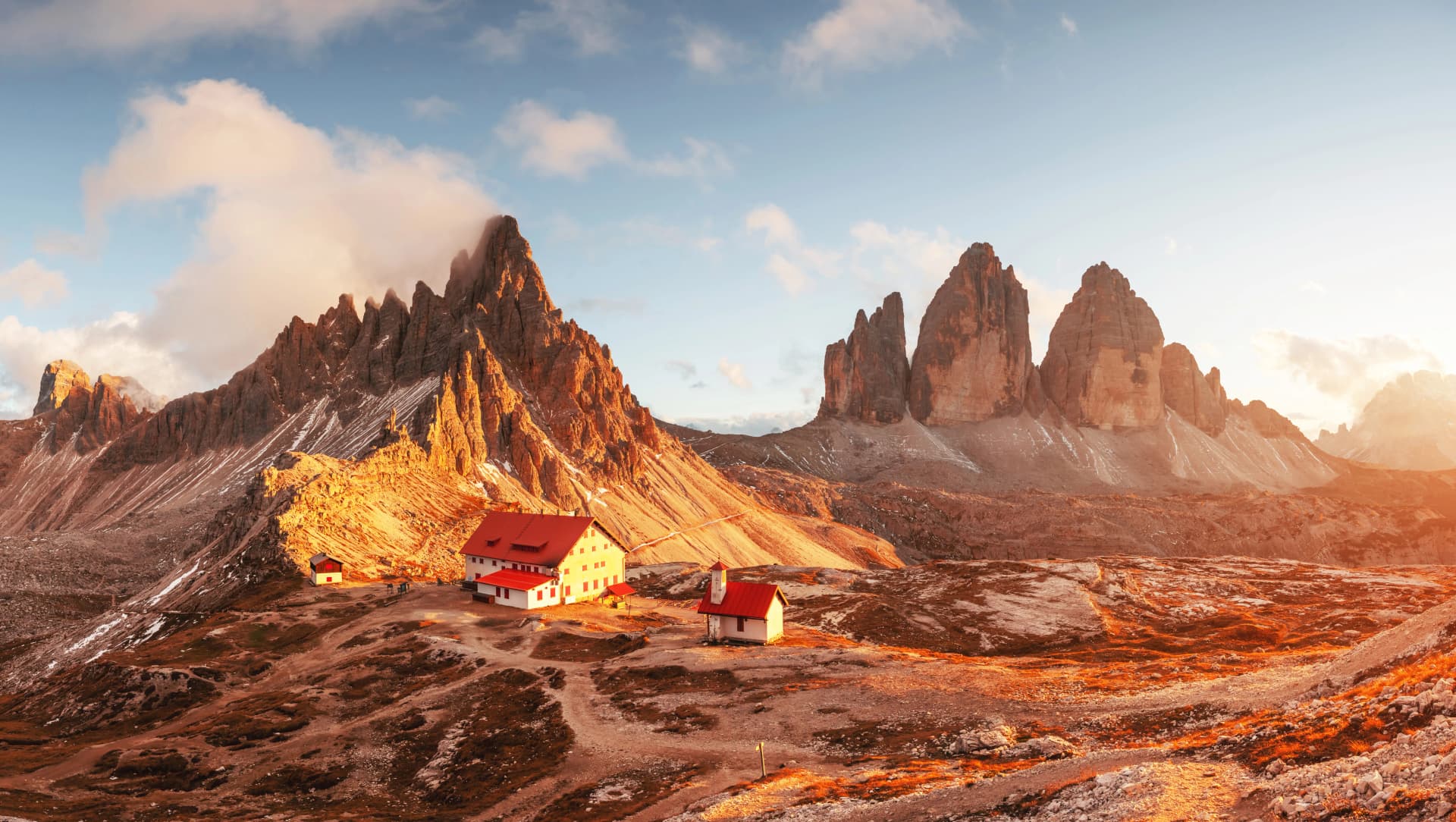 Incredible sunset at Rifugio Locatelli with Tre Cime di Lavaredo peaks in Dolomite Alps.